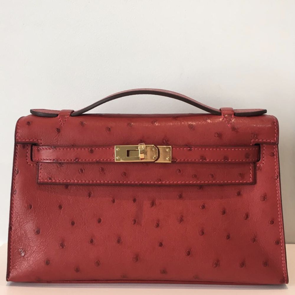 Hermes Rouge Vif Ostrich Kelly Pochette Bag with Gold Hardware. A,, Lot  #58112