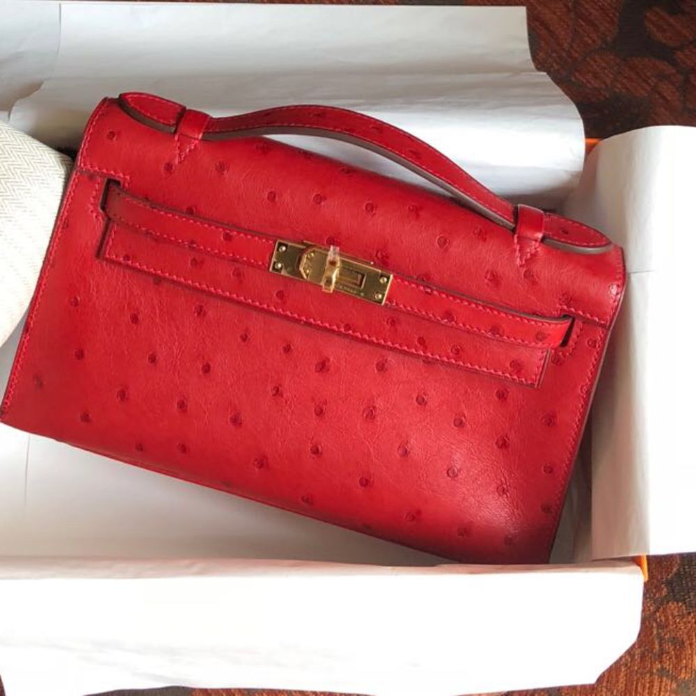 Hermes Rouge Vif Ostrich Kelly Pochette Bag with Gold Hardware. A